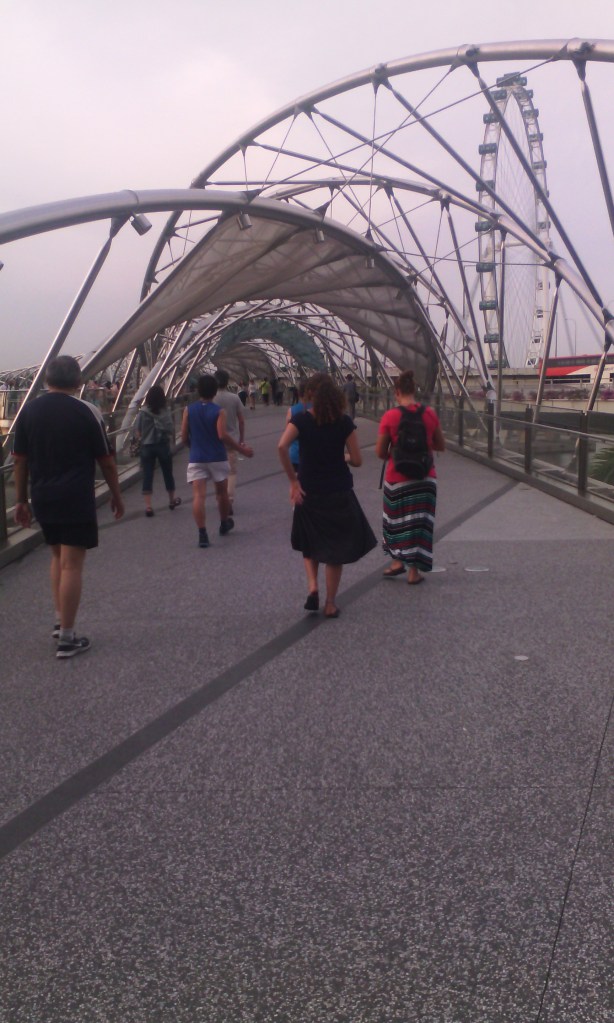 The Helix Bridge. Why build a normal bridge when you can make a cool looking one? That's me in the striped skirt.